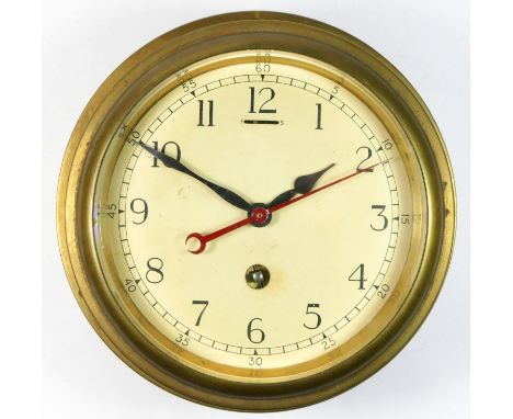 A solid brass ships clock, bevelled edge crystal with 8 day manual movement. Diameter 20cm. 