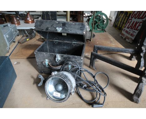 A vintage signalling light and case