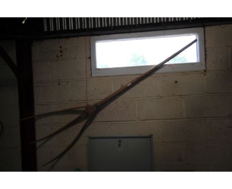 A rustic three tine wooden fork