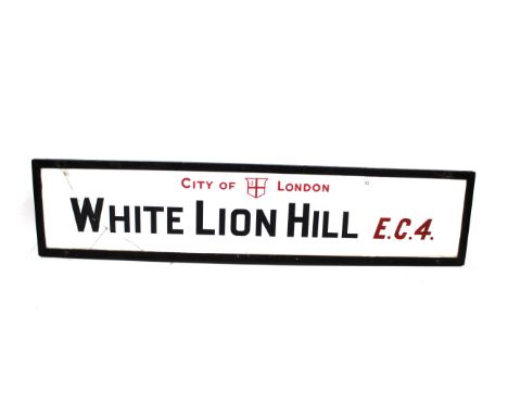 A "White Lion Hill EC4" vitreous white glass road sign, first introduced to the City of London Square Mile in the 1920's, rem