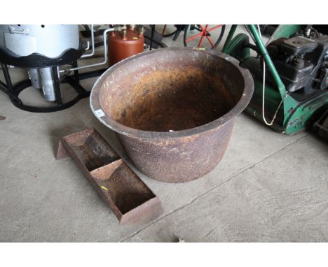 A cast iron boiler and a small two division feeding trough