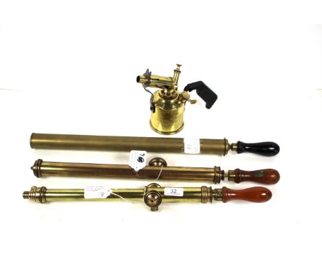 Three vintage brass garden sprayers and a vintage brass blow torch 