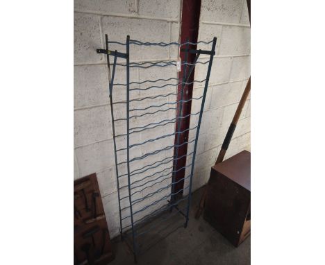 A vintage metal wine rack