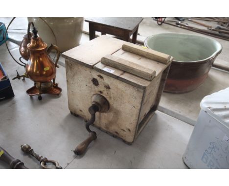 A vintage wooden butter churn