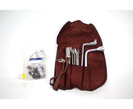 A vintage Mercedes MB SL, SE SEL tool kit circa 1954 and an original Mercedes Benz bonnet emblem and key tag