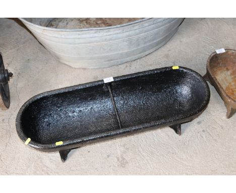 A two division iron feeding trough