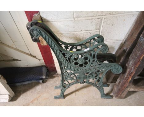 A pair of heavy cast iron bench ends