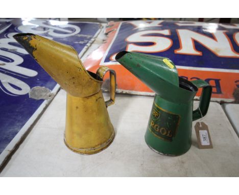 A yellow quart oil measure and a BP Energol quart oil measure
