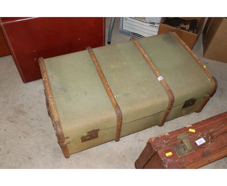 A canvas and battened travelling trunk