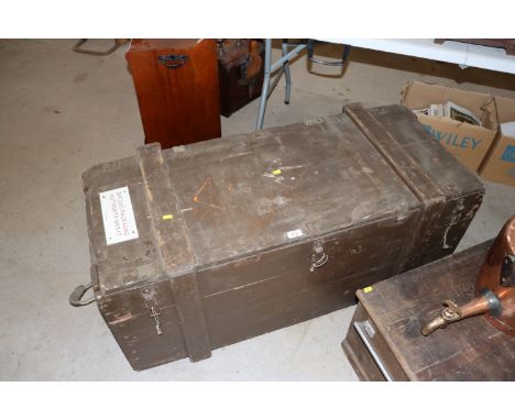 A vintage wooden army trunk bearing label "Special Packaging Authority No. 1347"