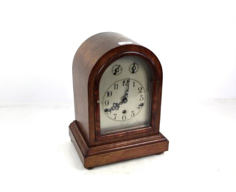 A mahogany cased three hole mantel clock 