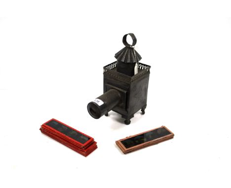 A small vintage Magic Lantern with adjuster lens and a quantity of 22 glass slides 