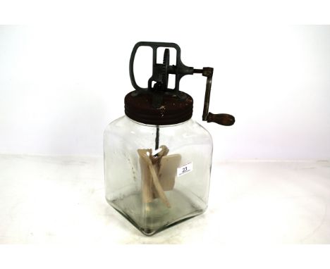 A vintage blow butter churn