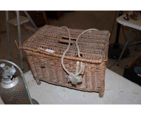 A vintage wicker fishing basket 