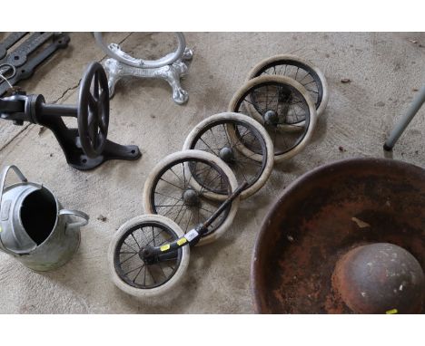 Five Dunlop white tired spoked wheels with brass caps, one with forks 