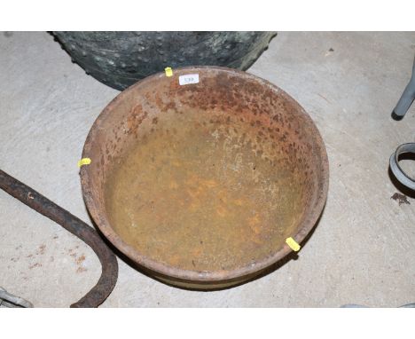 A round cast iron trough, approx. 17" dia.