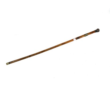 A Victorian dagger stick with brass feral and white metal handle 