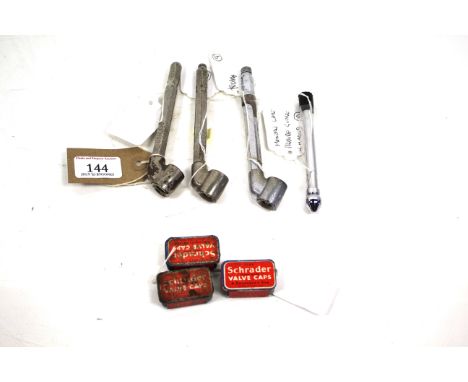 Four tyre pressure gauges to include Kismet and Dunlop No.12 and three Schroder tins containing valve caps