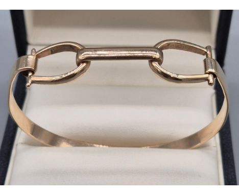 9ct yellow gold horse bit bangle. Marked 9ct. 12.90grams. 