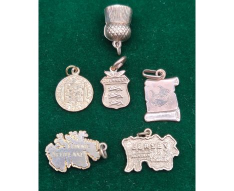 Six 9ct yellow gold charms. Bonnie Scotland charm, Jersey Charm, Guernsey charm and various others. 9.77grams.