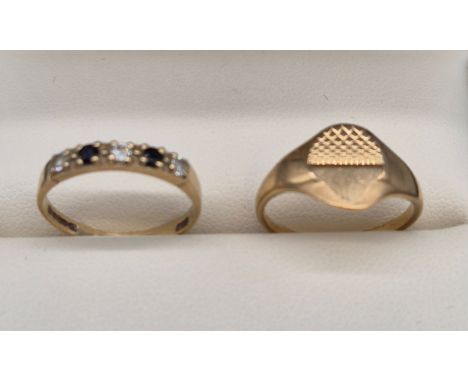 Two 9ct yellow gold rings. 9ct yellow gold signet ring- Ring size K. 9ct yellow gold, white stone and blue stone ring- Ring s