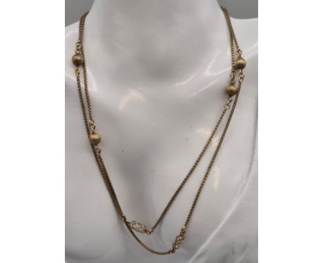 Import London 9ct yellow gold necklace fitted with spherical balls. 9grams. 72cm length.