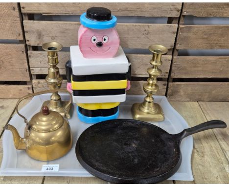 Tray of collectables; Pair of brass candle sticks, brass kettle, Bassett’s Liquorice Allsorts cookie jar and Wagners cast iro