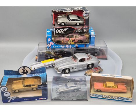 A Tray of collectable Models; Two Batman TV series Batmobils, James Bond vehicles Aston martin DB5 vehicles, Minnie mouse 1:2