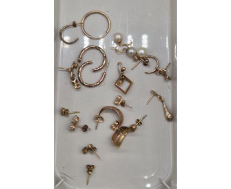 A Collection of 9ct yellow gold earrings and various single 9ct earrings. 10.52grams gross weight.
