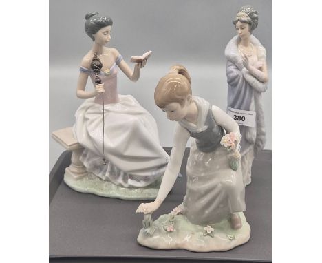 A Collection of Three Spanish Lladro porcelain figures; Flower picker, large woman figure holding book &amp; stick &amp; Even