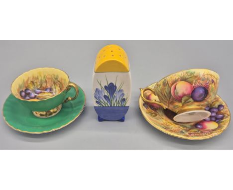 Two Aynsley orchard gold cups and saucers and Wedgwood sugar sifter; Aynsley gold orchard fruit pattern cup and saucer signed