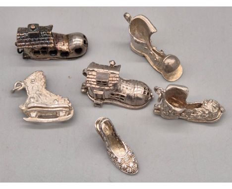 A Lot of six silver boot and shoe charms. 