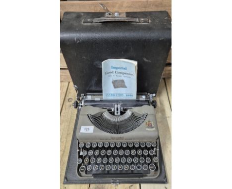 Antique Imperial Model T Typewriter within a fitted travel case. Comes with booklet. 
