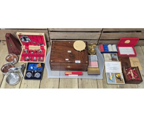 Tray of collectables; Mauchline ware thimble holder, Reproduction brass compass, Wine coasters, Wittner Metronome, Silver rim