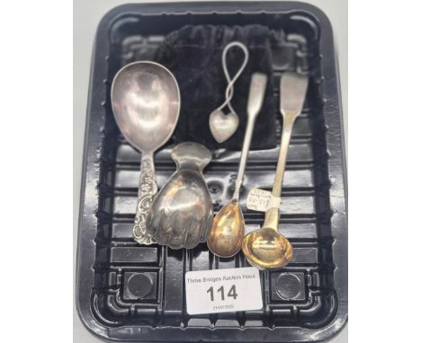 Five various silver utensils; Sterling silver hand shaped tea caddy spoon, London silver ornate handle tea caddy spoon, Georg