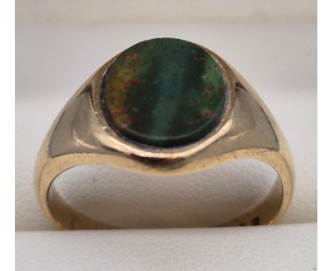 Birmingham 9ct yellow gold signet ring fitted with an oval blood stone. Maker JHW. [Ring size S] [5.34Grams] 
