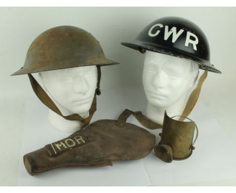 A collection of WWI & WWII ephemera To include a brass trench art shell in the form of  coal scuttle, leather pistol holster 