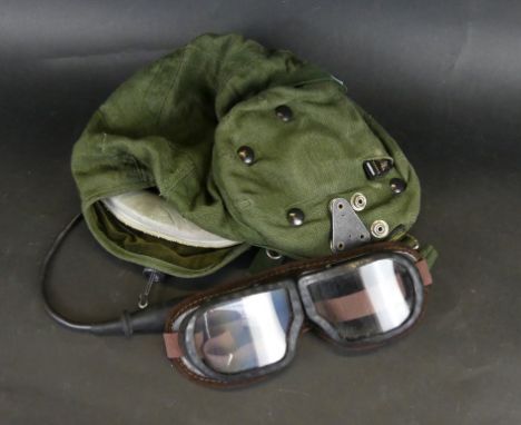 A collection of RAF itemsTo include metal rip cords, pilots green webbing helmet, leather covered flying goggles, airplane mo