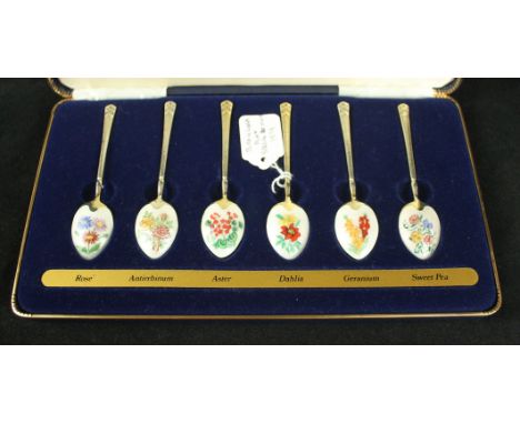 A cased set of six enamel and silver-gilt novelty teaspoonsEach teaspoon with an enamelled flower to the reverse, to a white 