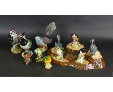 A collection of Beswick birds Comprising Lapwing (2416), Cuckoo (2315), Lesser Spotted Woodpecker (2420), together with eight