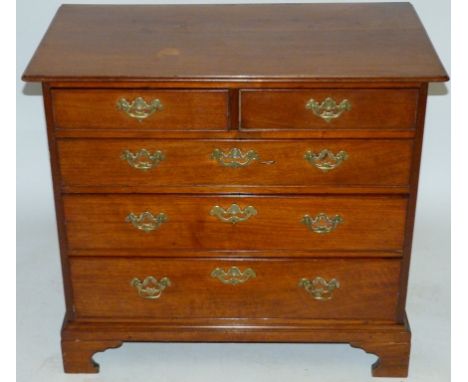 A Georgian mahogany straight front chest Of two short over three long drawers, raised on bracket supports, height 77cm, lengt
