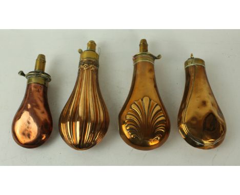Four copper and brass powder flasks mid 19th CenturyFirst of fluted decoration stamped J W Hawksley, further plain bodied fla