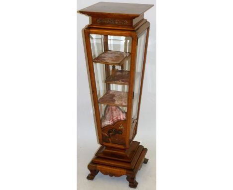 An early 20th Century bleached mahogany display cabinet, in the Japanese tasteHaving four bevelled glass panels, with applied