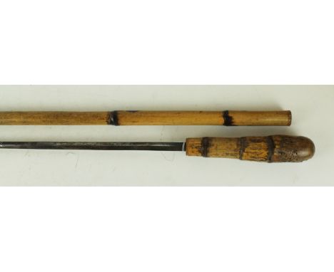 Sword stick late 19th Century70cm diamond shaped blade with blued decoration, bamboo grip complete with bamboo scabbard