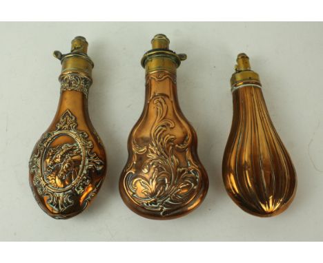 Three copper and brass powder flask mid 19th CenturyThe first decorated with 'Pharoahs Horses', maker G & J Hawksley of Sheff