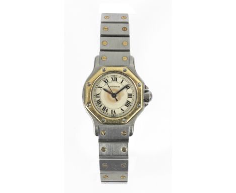 Cartier. Santos Octagon. Reloj de pulsera de dama. Caja y armis en acero con detalles en oro amarillo de 18 k., esfera con nu