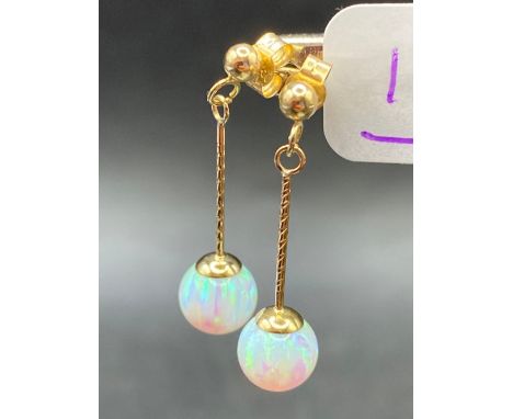 A pair of fine opal drop earrings