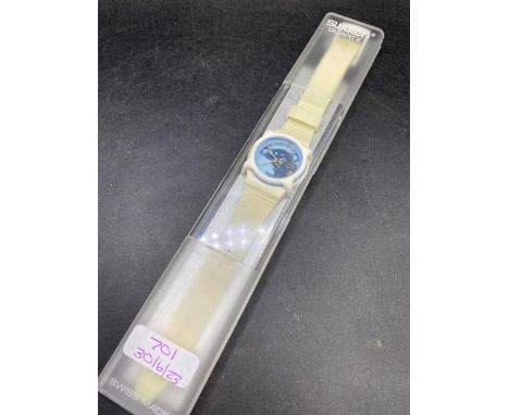 A contemporary swatch watch in box