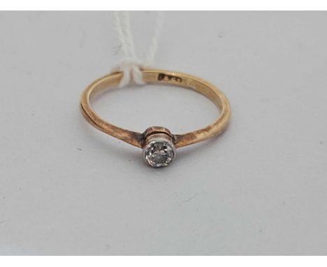 A solitaire diamond ring 18ct gold size J  1.2 gms