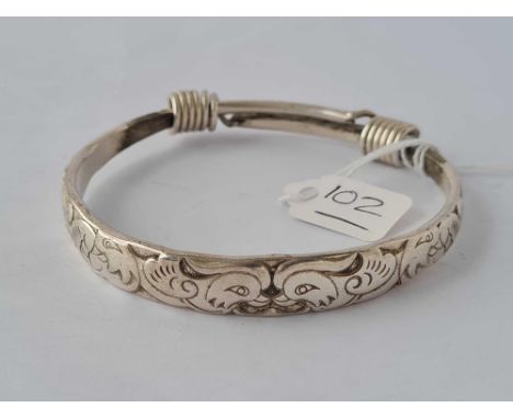 A oriental silver extending bangle